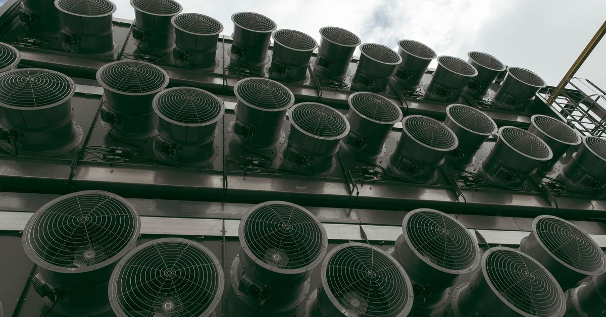 Rows of fans seen on the facade of an industrial plant.